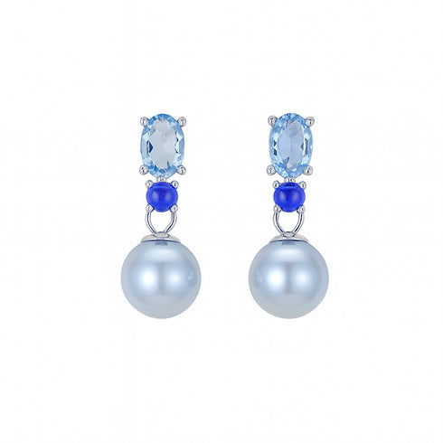 Pair of earrings with blue gemstones and pearl-like balls on a white background
